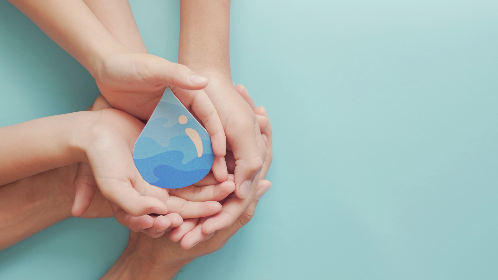 Water saving campaign, image showing hands holding a water droplet on green background.